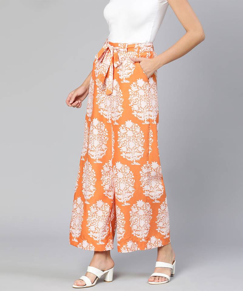 Orange colored printed elasticated women tie -knot pant