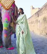 Light green woven silk saree with blouse