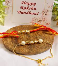 Gold-Toned Kundan Embellished Rakhi & Lumba Set of 2 