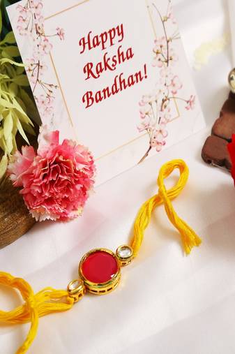 Red Gold Tone Kundan Rakhi With Yellow Thread