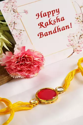 Red Gold Tone Kundan Rakhi With Yellow Thread