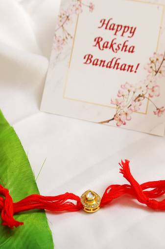 High Quality Kundan Studded Rakhi With Yellow Cotton Thread