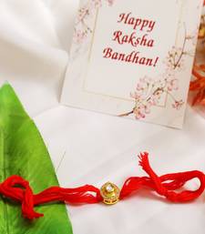High Quality Kundan Studded Rakhi With Yellow Cotton Thread