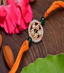 Kundan Floral Gold Tone Kundan Rakhi With Organish Yellow
