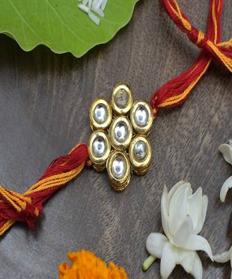 Kundan Floral  Gold Tone Kundan Rakhi With Red Yellow Cotton Thread 1
