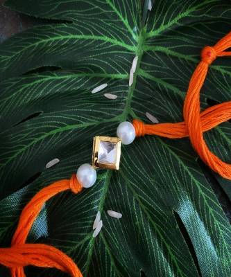 Orange Pearl Gold Tone Kundan Rakhi 1
