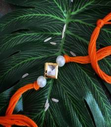 Orange Pearl Gold Tone Kundan Rakhi