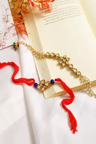 Gold-Toned Kundan Embellished Rakhi & Floral Lumba Set Of 2 