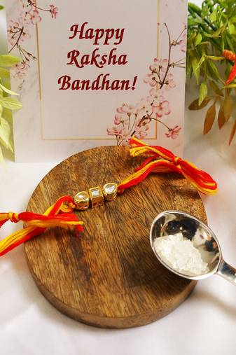 Gold Tone Kundan Rakhi With Red Yellow Cotton Thread