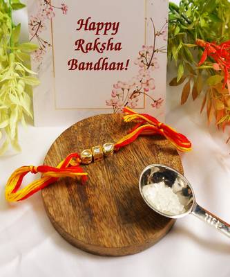 Gold Tone Kundan Rakhi With Red Yellow Cotton Thread 1