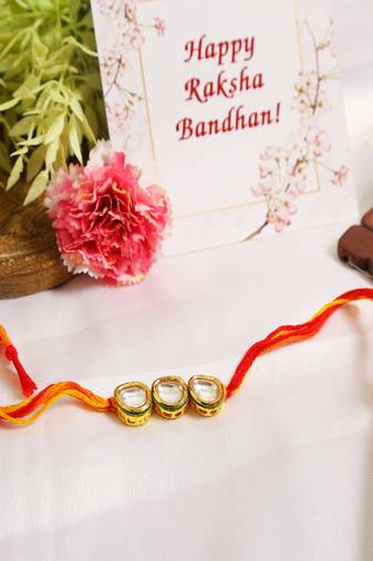 Gold Tone Kundan Rakhi With Red Yellow Cotton Thread