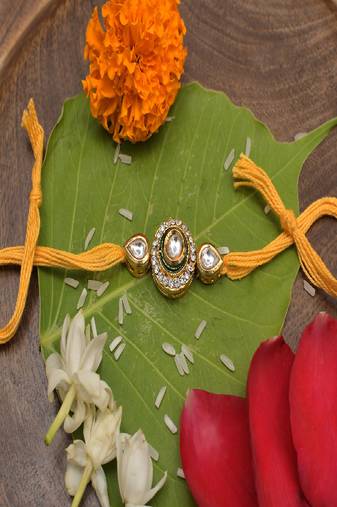 High Quality Kundan Studded Rakhi With Yellow Cotton Thread