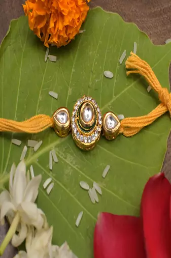 High Quality Kundan Studded Rakhi With Yellow Cotton Thread