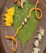 Gold Tone Kundan Rakhi With Yellow Cotton Thread