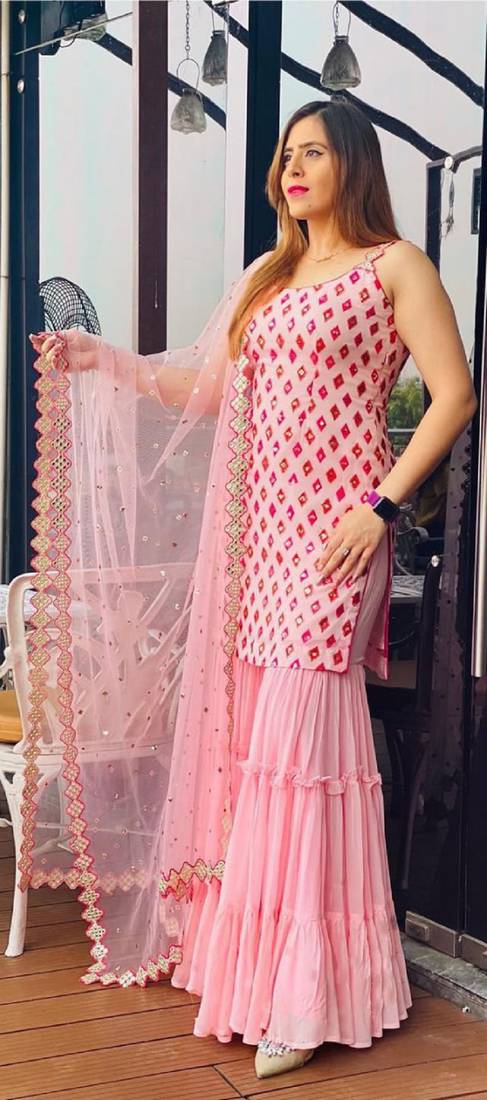 Captivating Baby Pink Faux Georgette multi layered party wear Sharara suit