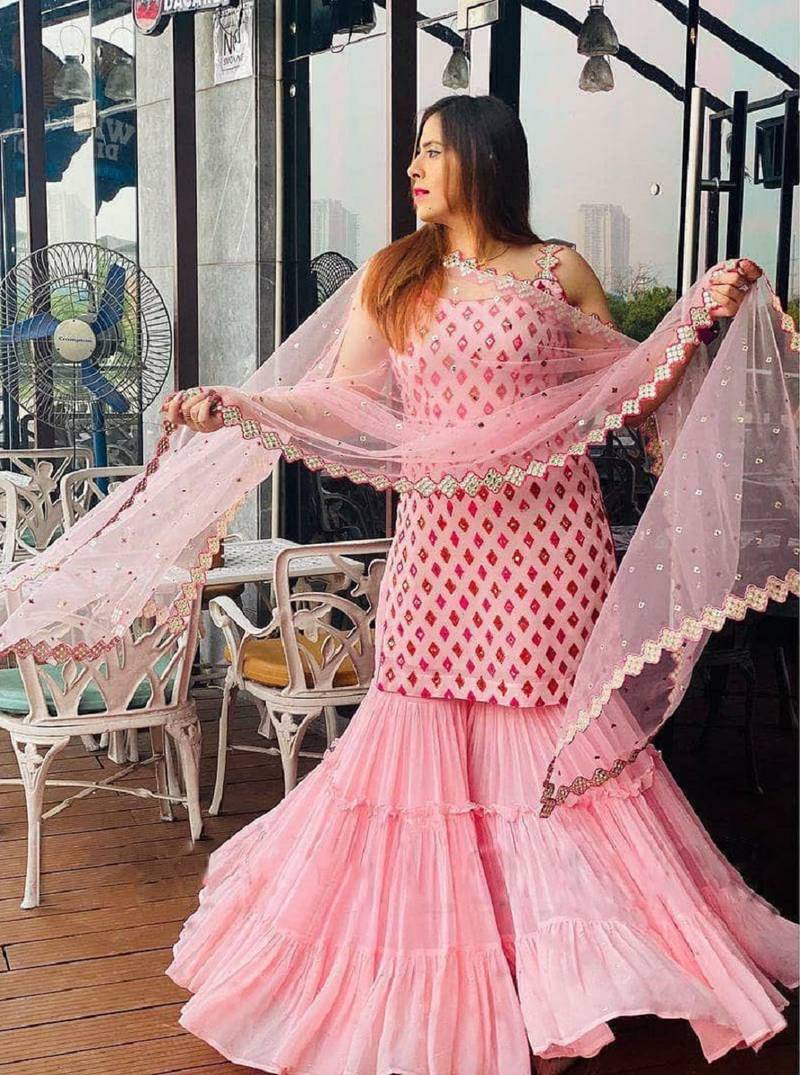 Captivating Baby Pink Faux Georgette multi layered party wear Sharara suit