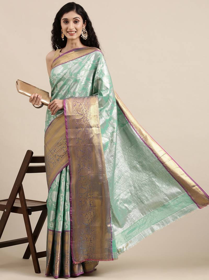 Green woven banarasi silk saree with blouse