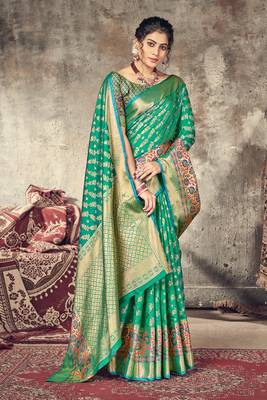 Dark green woven silk saree with blouse 1