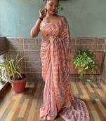 Peach embroidered faux georgette saree with blouse