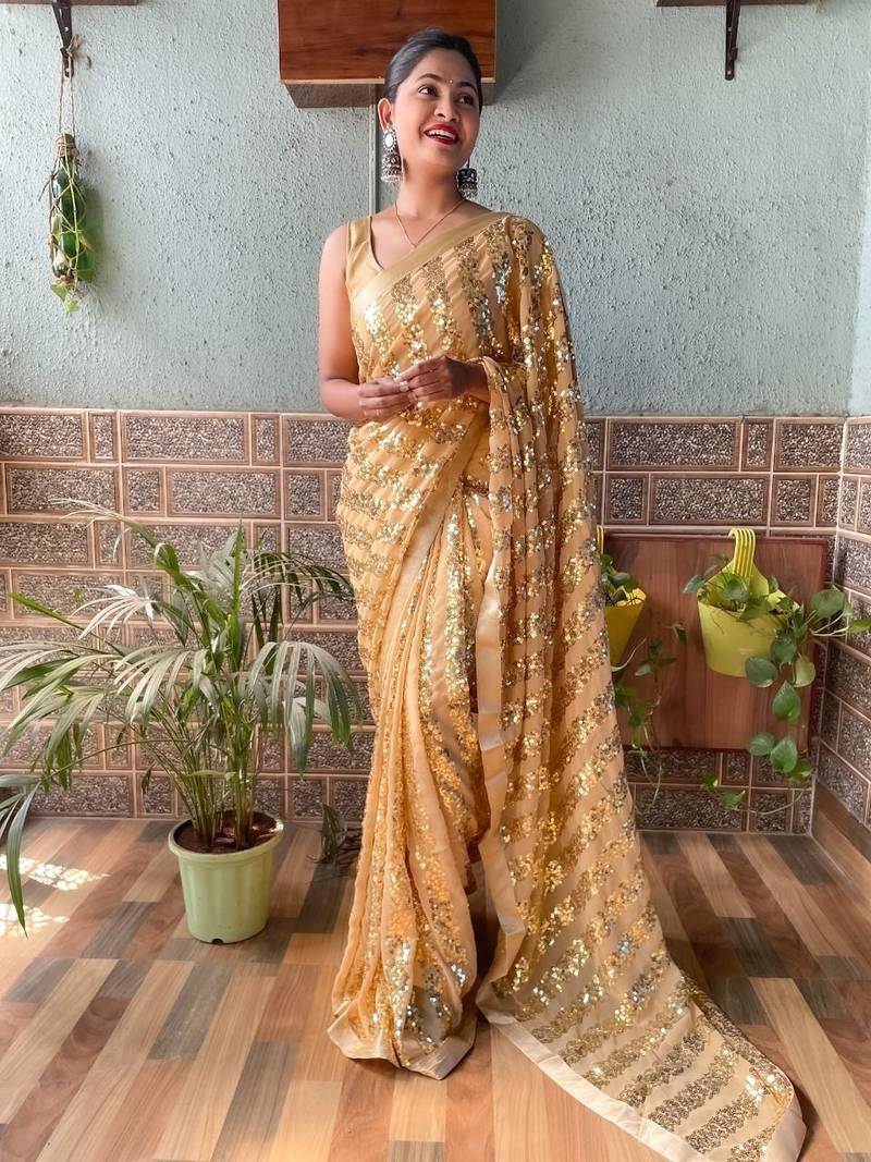 Light orange embroidered faux georgette saree with blouse