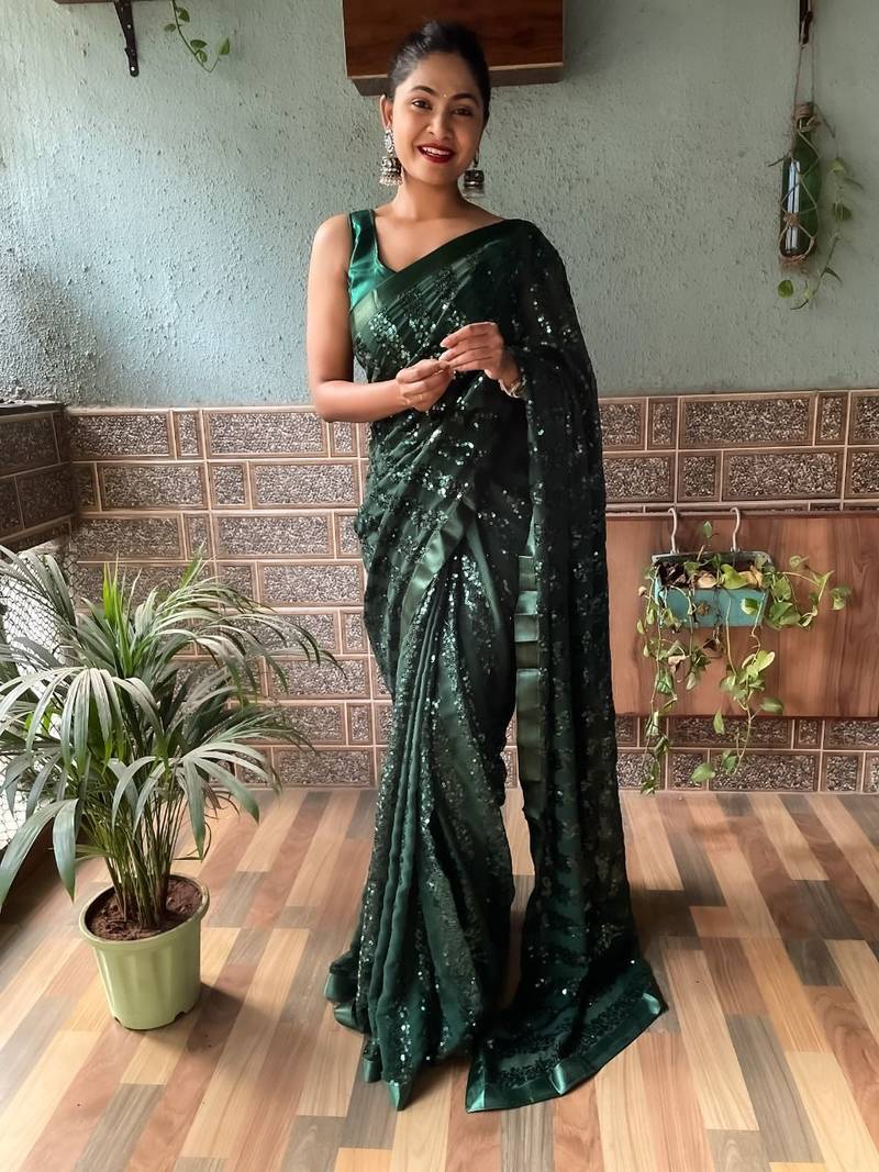 Dark green embroidered faux georgette saree with blouse