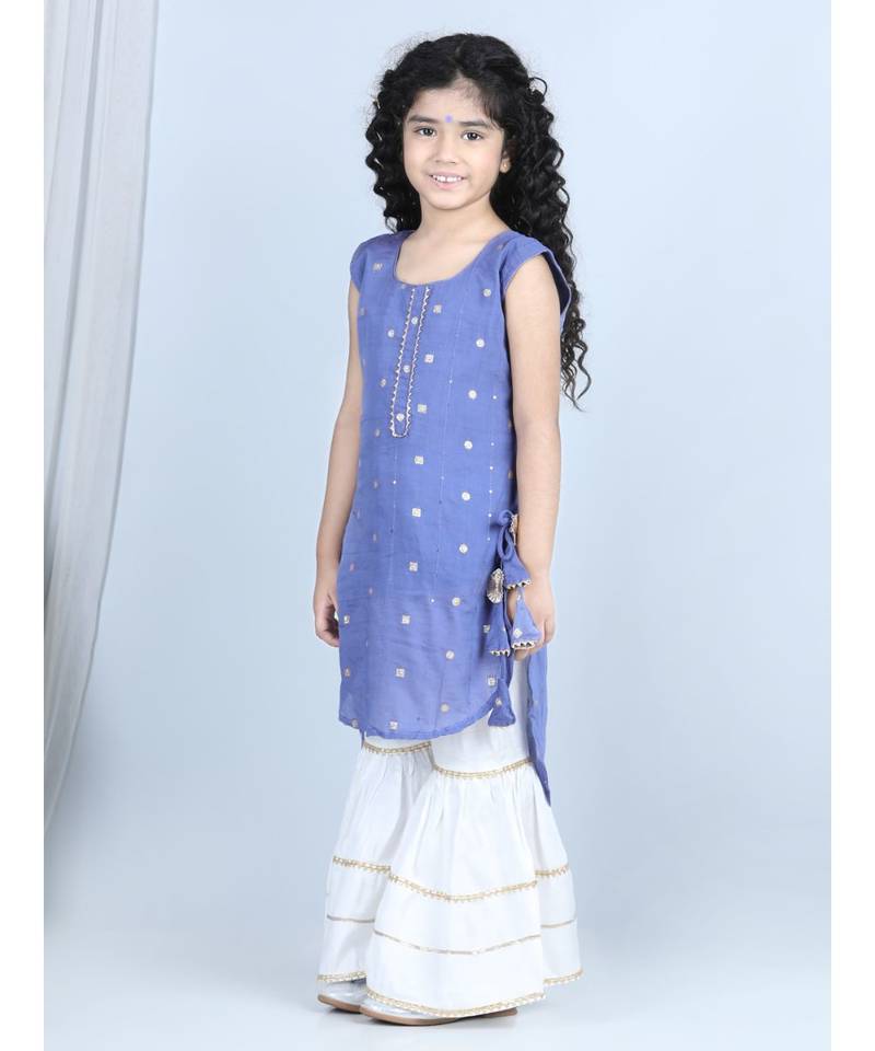 Purple gold jacquard printed kurti with tassles work paired with offwhite Sharara