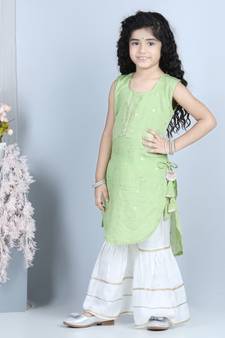 Green gold jacquard printed kurti with tassles work paired with offwhite Sharara