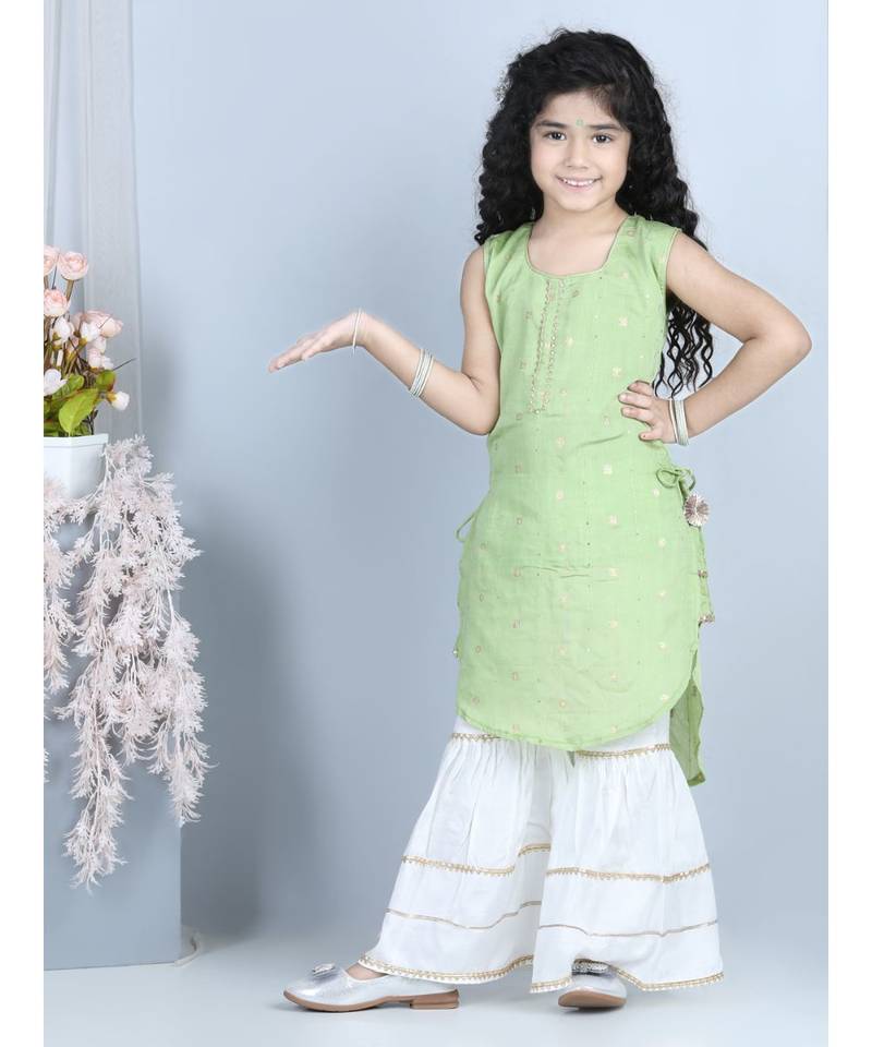 Green gold jacquard printed kurti with tassles work paired with offwhite Sharara