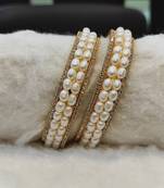 White pearl bangles-and-bracelets