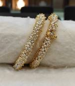 White pearl bangles-and-bracelets