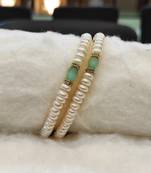 White pearl bangles-and-bracelets