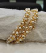 White pearl bangles-and-bracelets