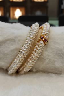 White pearl bangles-and-bracelets