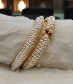 White pearl bangles-and-bracelets