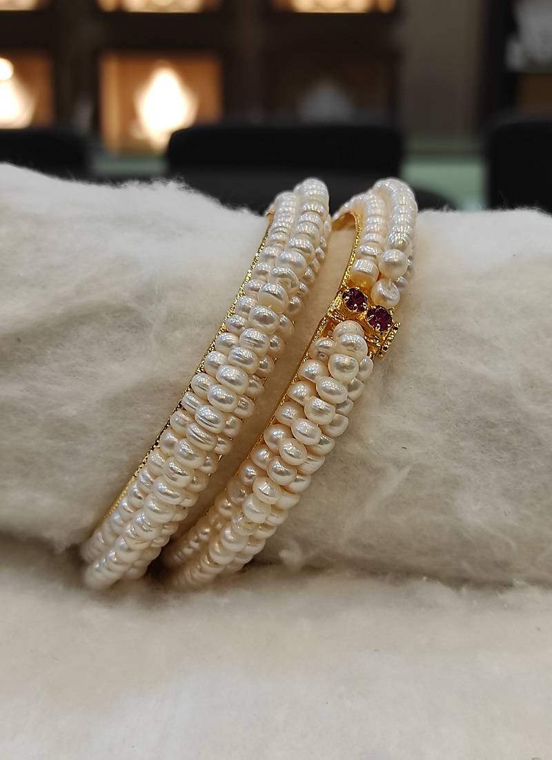 White pearl bangles-and-bracelets