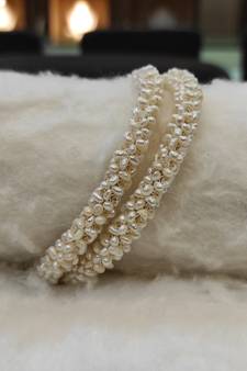 White pearl bangles-and-bracelets