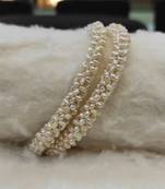 White pearl bangles-and-bracelets