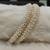 White pearl bangles-and-bracelets