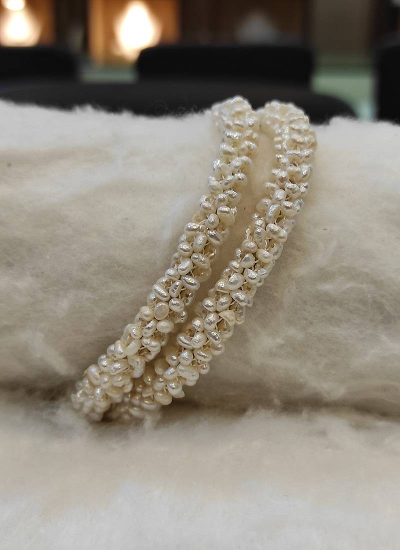 White pearl bangles-and-bracelets