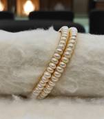 White pearl bangles-and-bracelets