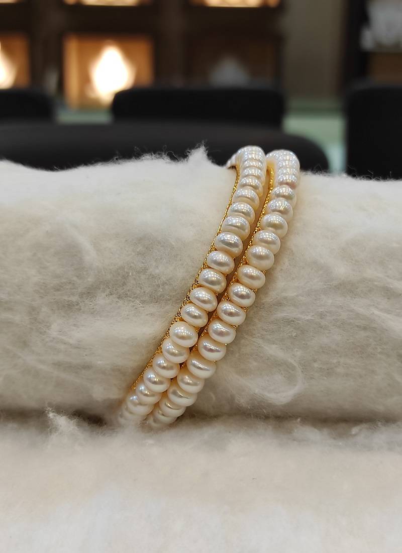 White pearl bangles-and-bracelets
