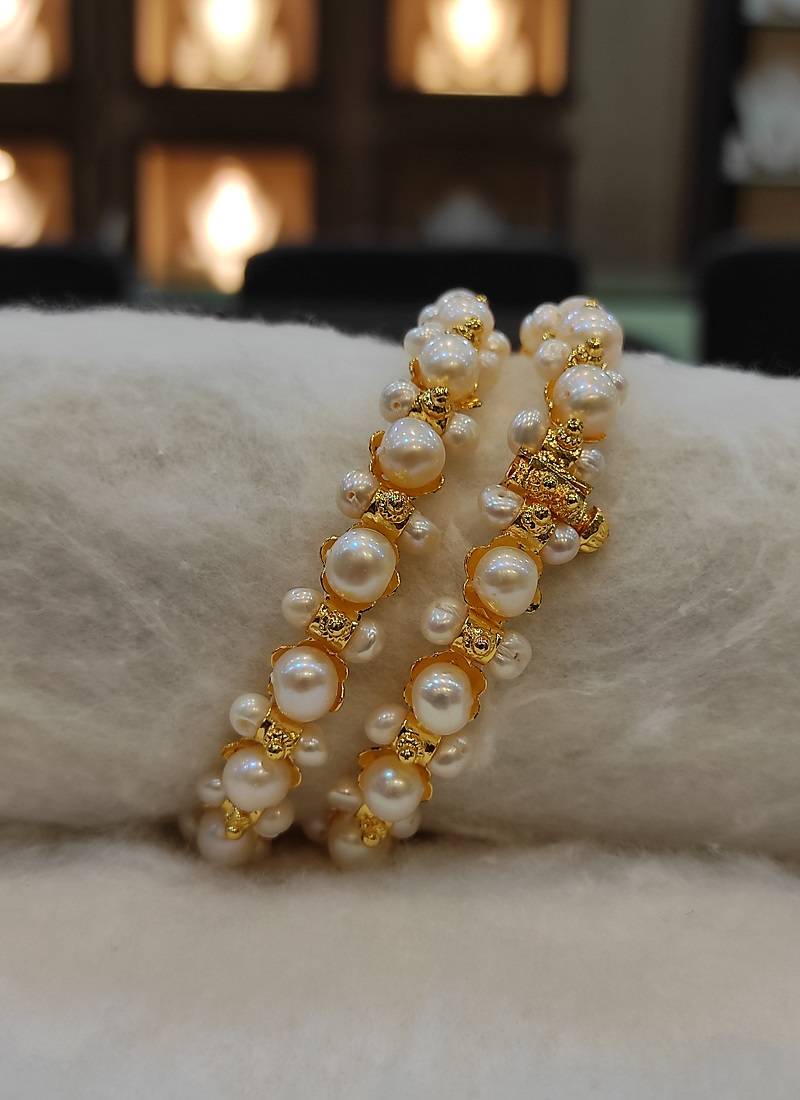 White pearl bangles-and-bracelets