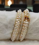 White pearl bangles-and-bracelets