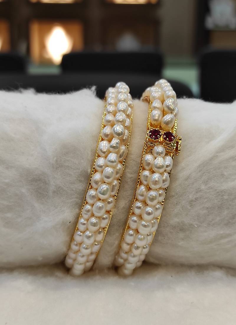 White pearl bangles-and-bracelets