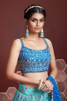 sky blue zari and sequins embroidered silk lehenga with mirror work choli and soft net dupatta