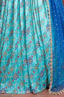 sky blue zari and sequins embroidered silk lehenga with mirror work choli and soft net dupatta