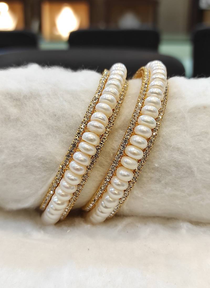 White pearl bangles-and-bracelets