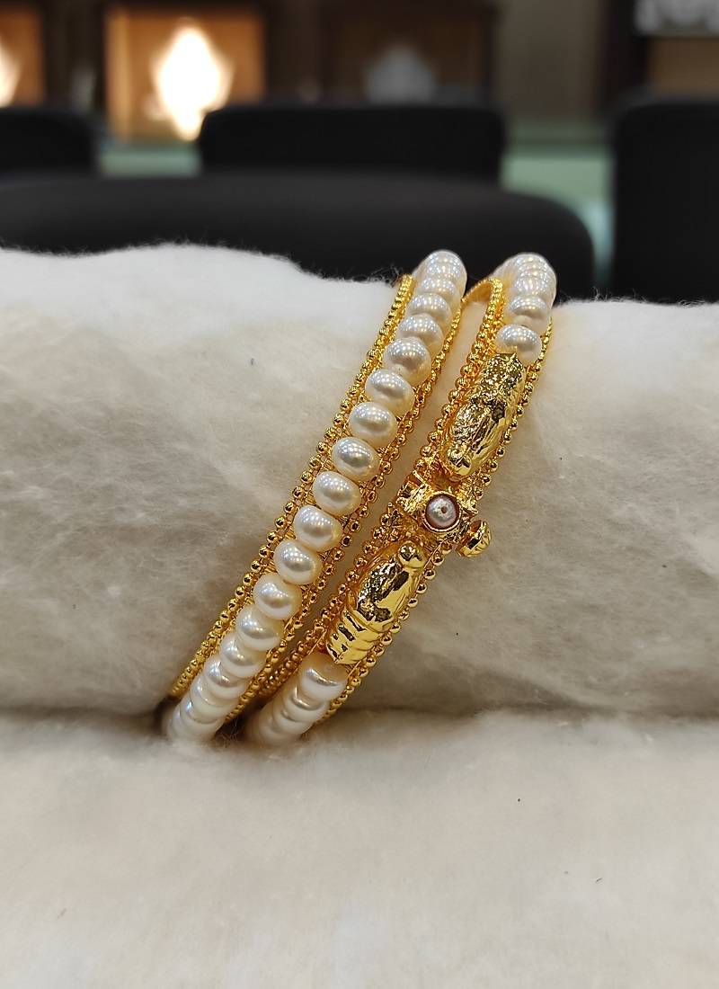 White pearl bangles-and-bracelets