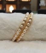 White pearl bangles-and-bracelets