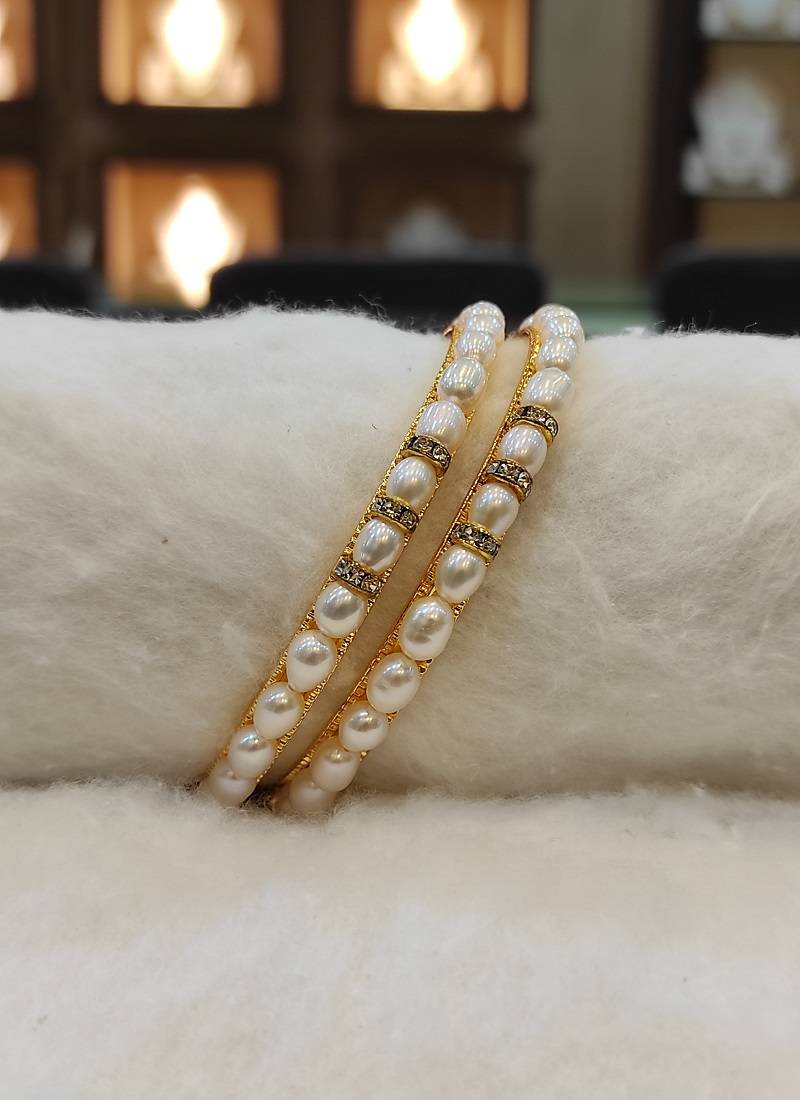 White pearl bangles-and-bracelets